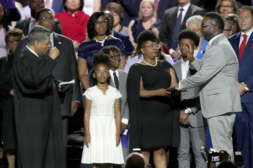 Chicago Mayor-elect Brandon Johnson, right, takes the oath of office from Cook County Chief Judge Tim Evans, as the city's 57th mayor Monday, May 15, 2023, in Chicago. (AP Photo/Charles Rex Arbogast)