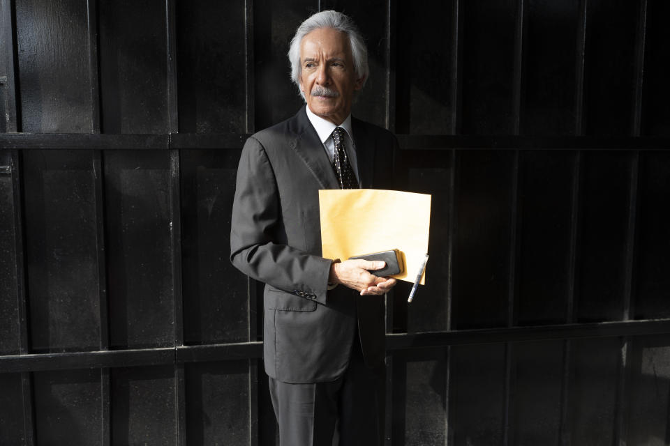 Guatemalan journalist Jose Ruben Zamora, founder of El Periodico newspaper, arrives to court in handcuffs for a hearing in Guatemala City, Wednesday, May 15, 2024. Zamora has been jailed for almost two years and seeks his release. (AP Photo/Moises Castillo)