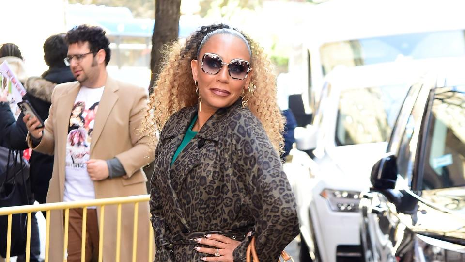 Mel B is seen outside "The View" on March 25, 2024 in New York City wearing a leopard print trench coat and matching heels