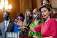 House Speaker Nancy Pelosi of Calif., accompanied by other House Democrats and climate activists, pauses while speaking about their "Build Back Better on Climate" plan on Capitol Hill in Washington, Tuesday, Sept. 28, 2021. (AP Photo/Andrew Harnik)