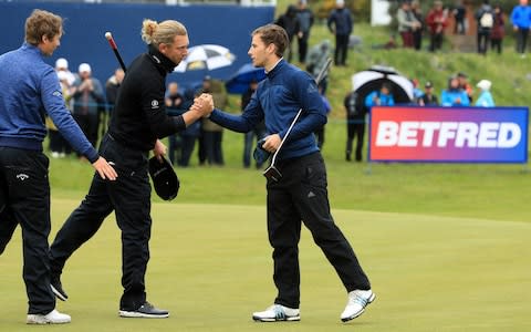 Matthew Jordan of England shakes hands with Marcel Siem of Germany on the 18th during Day One of the Betfred British Masters at Hillside Golf Club on May 09, 2019 in Southport - Credit: Getty Images