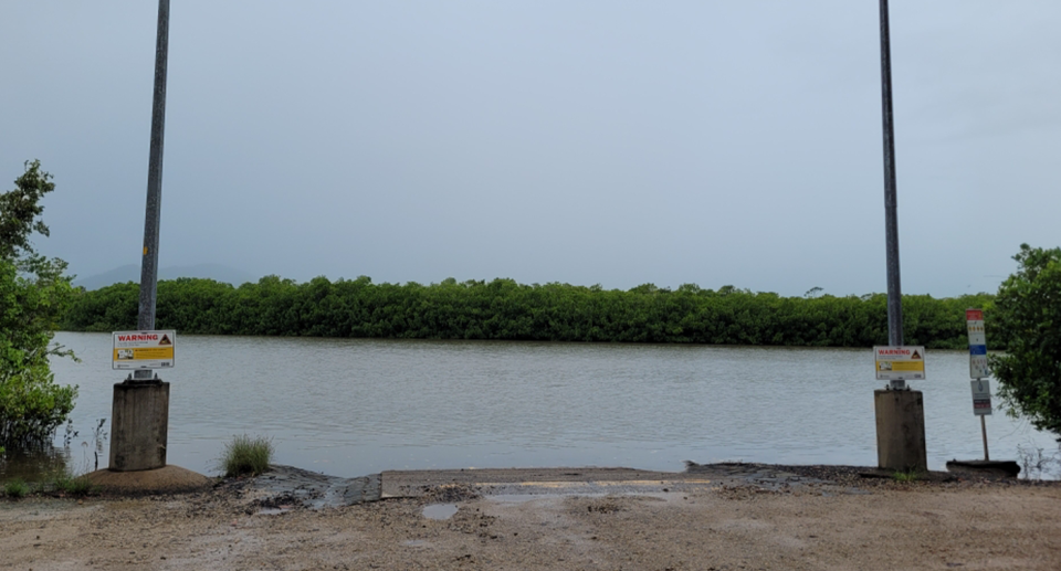 The Maria Creek boat ramp at Kurrimine Beach on the Cassowary Coast with crocodile warning signs at each side.