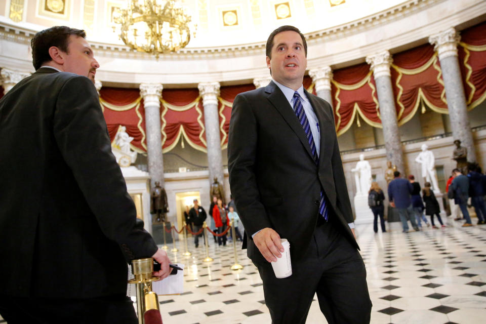 FILE PHOTO -- U.S. House Permanent Select Committee on Intelligence Chairman Representative Devin Nunes (R-CA) crosses paths with reporters as he departs Speaker Paul Ryan's office at the U.S. Capitol in Washington, U.S., March 24, 2017. REUTERS/Jonathan Ernst/File Photo