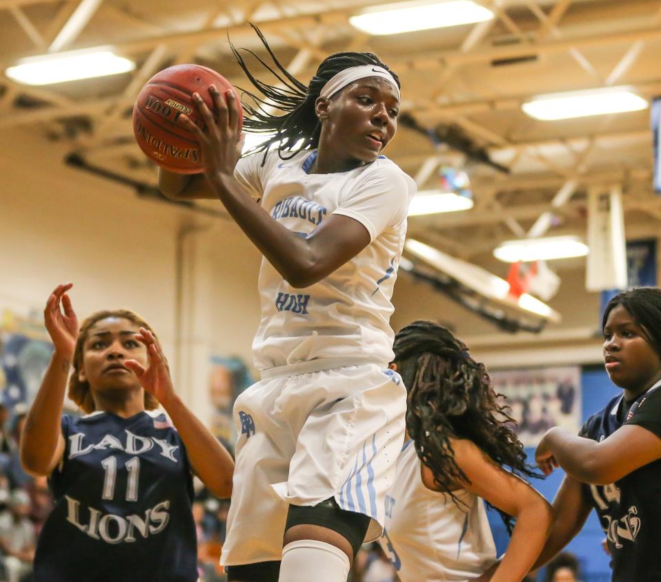 Ribault's Rennia Davis (10) grabs a defensive rebound against Potter's House during a 2016 girls basketball game.