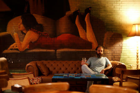 Somar Hazim, 35, poses for a photograph inside his pub in Old Damascus, Syria, May 15, 2017. REUTERS/Omar Sanadiki