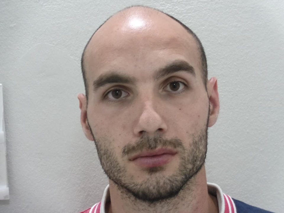 This undated handout photo provided by the Greek Police and released on Thursday, July 18 2019 shows 27-year-old Yiannis Paraskakis, accused of the brutal killing of American Suzanne Eaton. Greek authorities say they have identified a suspect accused of the brutal killing and rape of American scientist Suzanne Eaton. Paraskakis has been charged with the rape and murder of Eaton, 59, who disappeared on July 2 while attending a conference near Chania and whose body was found six days later in an abandoned underground storage site used during World War II. (Greek Police via AP)