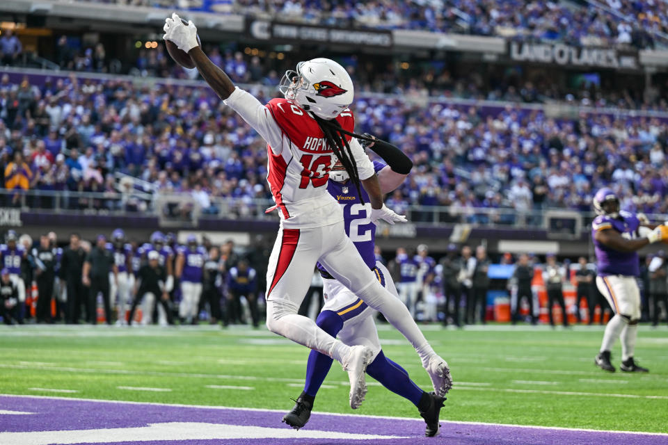 Oct 30, 2022; Minneapolis, Minnesota, USA; Arizona Cardinals wide receiver DeAndre Hopkins (10) catches a touchdown pass from quarterback Kyler Murray (not pictured) as Minnesota Vikings safety Harrison Smith (22) defends during the second quarter at U.S. Bank Stadium.