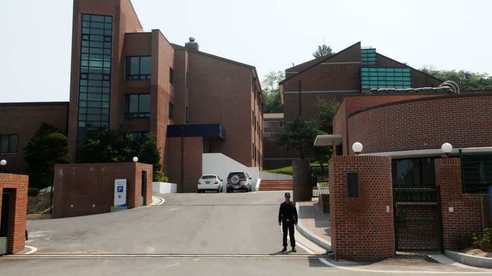 A security guard stands outside Hanawon in Anseong, South Korea, on May 28, 2009.  - Seokyong Lee/Bloomberg/Getty Images