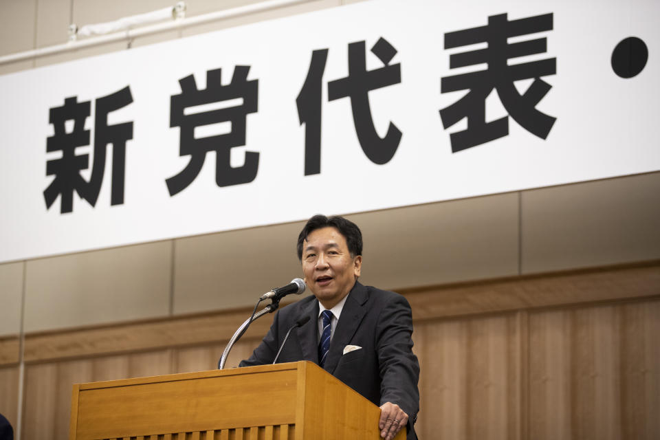 Yukio Edano, the leader newly elected after two opposition parties' merger, speaks during a news conference in Tokyo on Thursday, Sept. 10, 2020. A 149-member group on Thursday chose Edano, a lawyer-turned politician, as new leader and decided to adopt the Constitutional Democratic Party of Japan, the name of the party he previously headed, as two main opposition parties merged. The word, partly seen at top, read: " New party leader". (AP Photo/Hiro Komae)