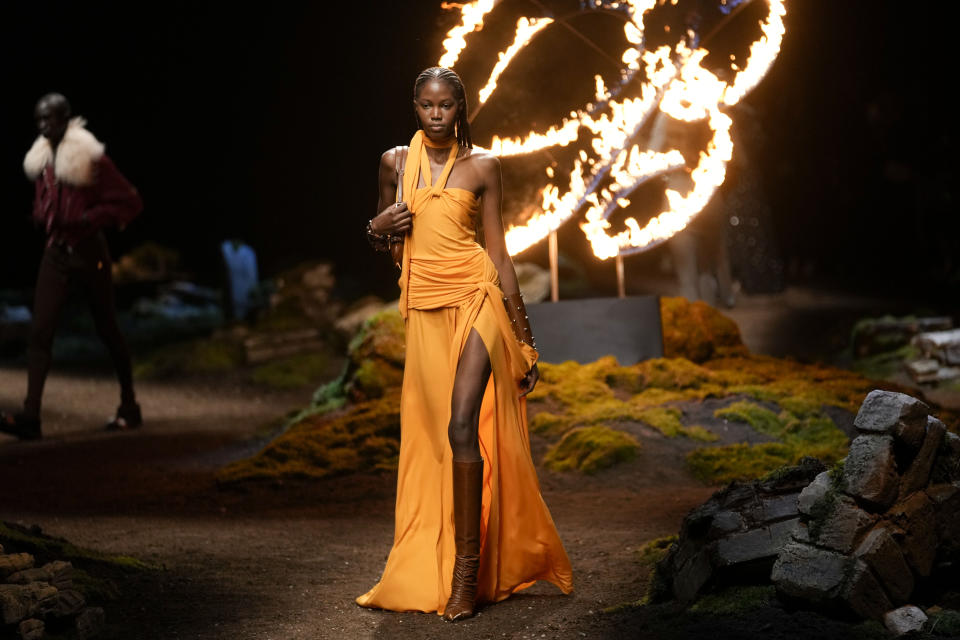 A model wears a creation as part of the Blumarine women's Fall-Winter 2023-24 collection presented in Milan, Italy, Thursday, Feb. 23, 2023. (AP Photo/Luca Bruno)