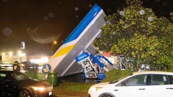 PHOTO: A damaged Valero gas station creaks in the wind during a massive 'bomb cyclone' rain storm in South San Francisco, Jan. 4, 2023. (Josh Edelson/AFP via Getty Images)