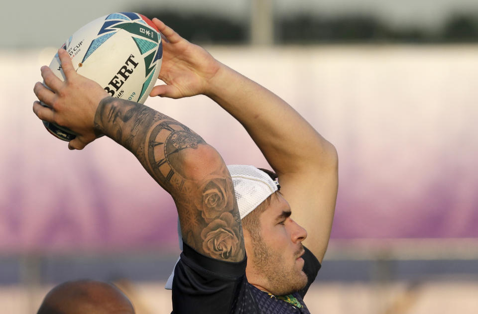 South Africa's Malcolm Marx throws a ball during a training session in Tokyo, Japan, Wednesday, Oct. 23, 2019. The Springboks play Wales in a Rugby World Cup semifinal in Yokohama on Sunday Oct. 27. (AP Photo/Mark Baker)