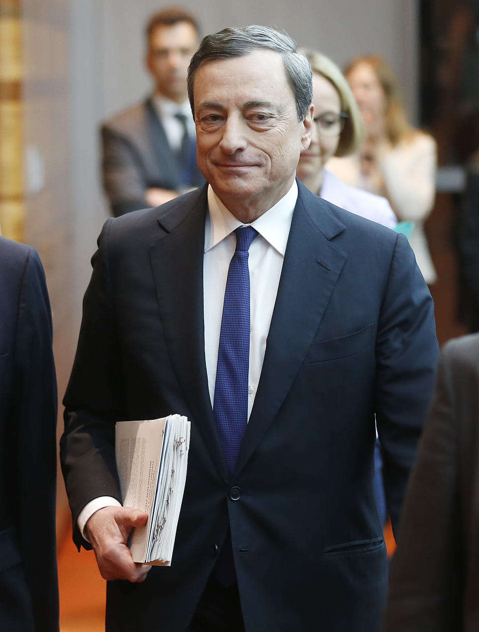 President of European Central Bank, ECB, Mario Draghi is on his way to a news conference in Frankfurt, Germany, Thursday, April 3, 2014, following a meeting of the ECB governing council. The ECB decided to leave its main interest rate unchanged. (AP Photo/Michael Probst)