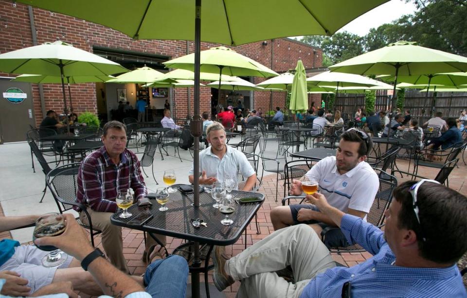 In the heart of downtown Cary, Bond Brothers, photographed in June 2017, is one of North Carolina’s most acclaimed breweries. Its wide brick patio is strung with lights and spaced-out tables.