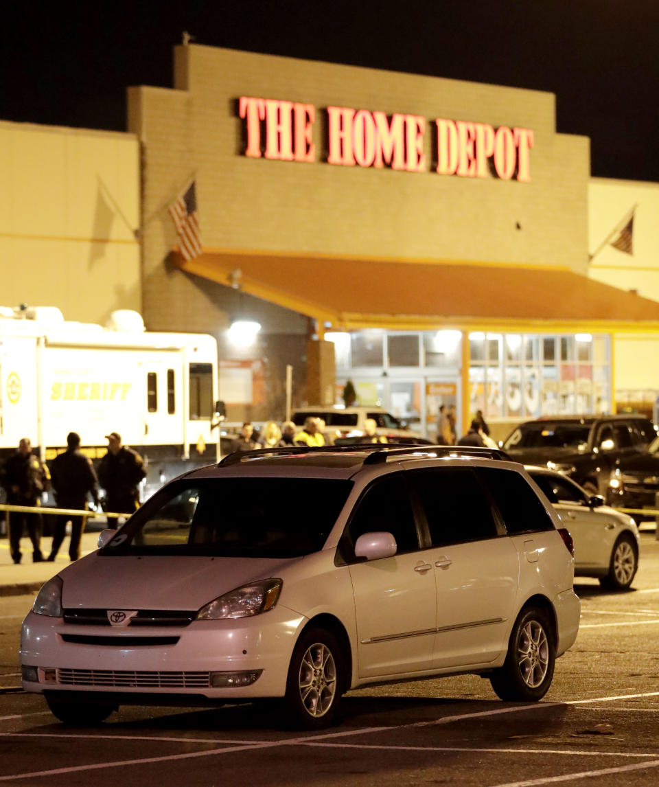 <p>A vehicle is surrounded by a police perimeter in the parking lot of a Home Depot store, Tuesday, Oct. 31, 2017, in Passaic, N.J. Police investigating a rented Home Depot truck’s deadly rampage down a bike path near New York’s World Trade Center have surrounded the white Toyota minivan with Florida plates parked in a New Jersey Home Depot lot. (Photo: Julio Cortez/AP) </p>