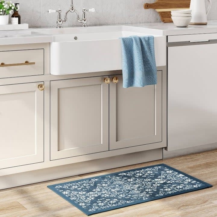 The blue patterned mat in a kitchen