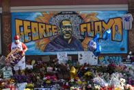 Community members visit the site of George Floyd's killing