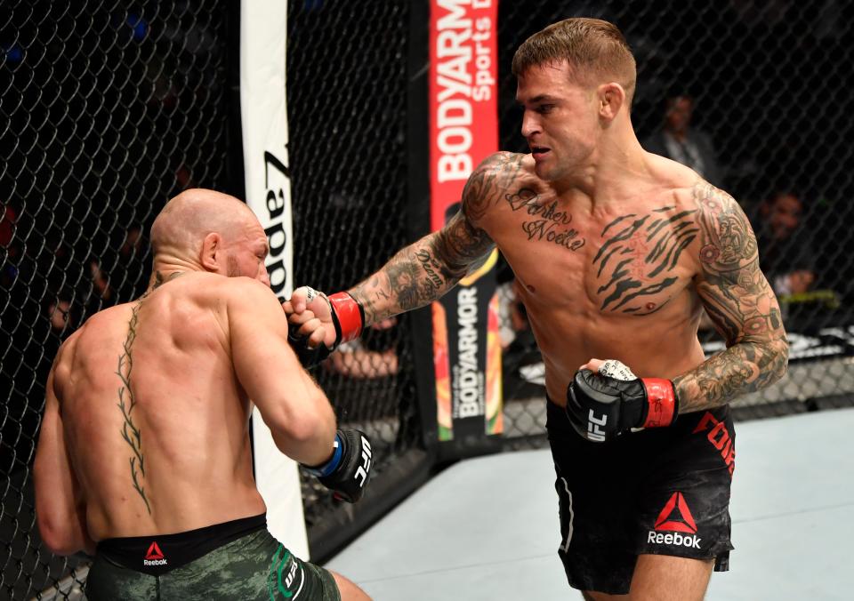 <p>Dustin Poirier knocks out Conor McGregor in the pair’s UFC rematch in January</p> (Zuffa LLC via Getty Images)