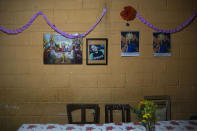 A framed portrait of Jenifer Vasquez hangs on a dining room wall in her grandmother's home, in Guatemala City, Thursday, Sept. 17, 2020. Vasquez was 32 when she died of renal problems in June, leaving behind her grief-stricken parents, Fabio Rodolfo Vasquez and Maria Moreno, who were already struggling with the isolation of the new coronavirus lockdown. (AP Photo/Moises Castillo)