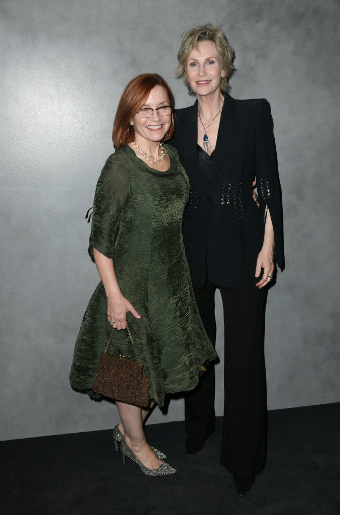 Jennifer Cheyne and Jane Lynch posing on a red carpet