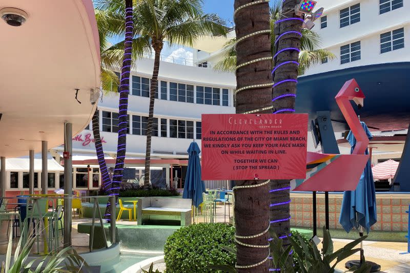 A sign warning guests about coronavirus disease is seen at the Clevelander South Beach Hotel and Bar in Miami Beach