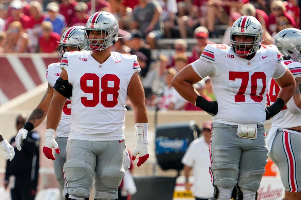 Ohio State offensive linemen Luke Montgomery (98) and Josh Fryar (70) watch for a play call during last year's game at Indiana.