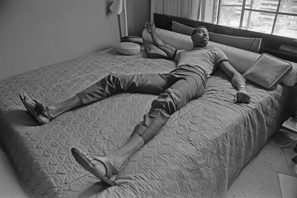 Wilt Chamberlain laying in bed.