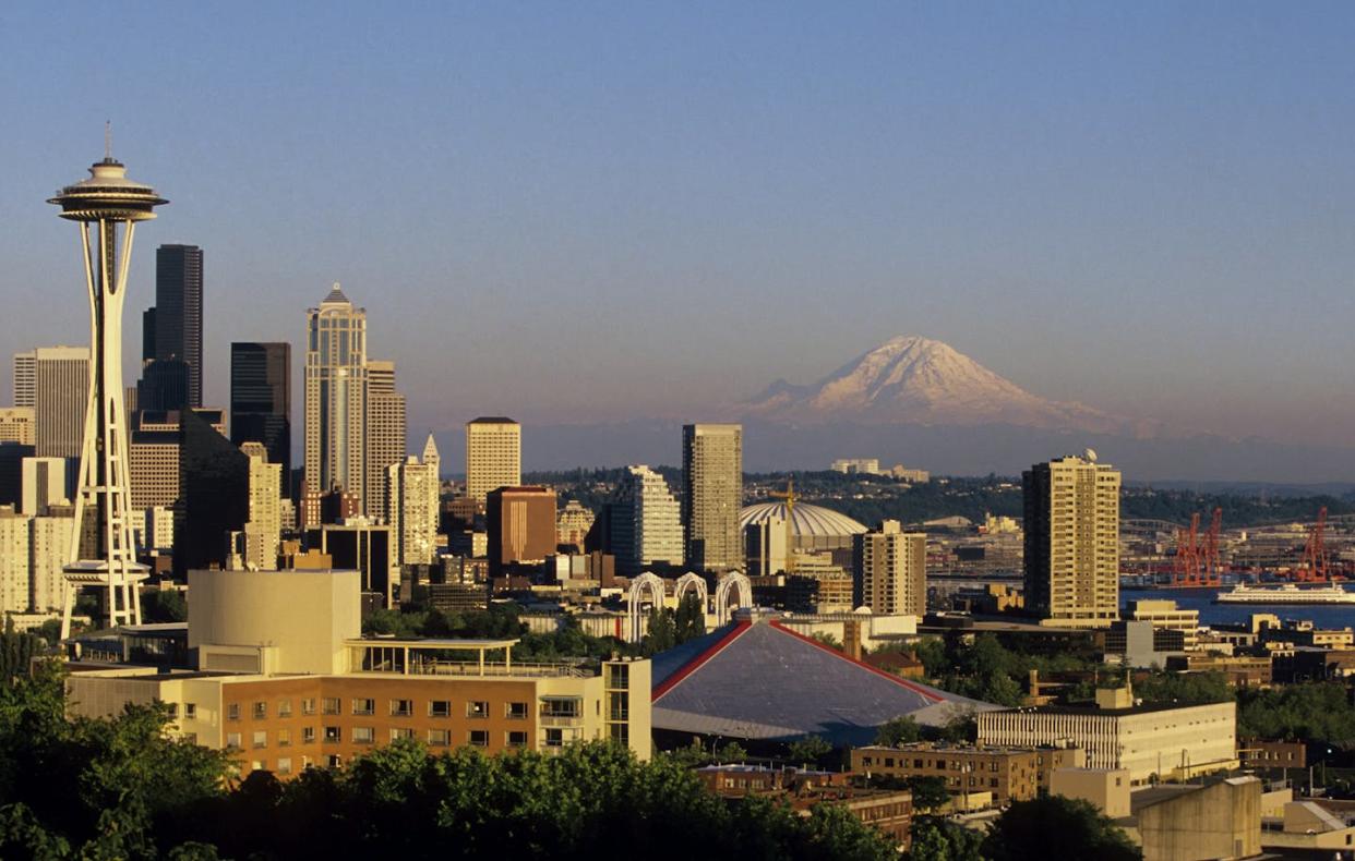 The Seattle skyline with Mt. Rainier in the background. <a href="https://www.gettyimages.com/detail/news-photo/washington-seattle-skyline-with-mt-rainier-in-background-news-photo/452516010?adppopup=true" rel="nofollow noopener" target="_blank" data-ylk="slk:Wolfgang Kaehler/LightRocket via Getty Images;elm:context_link;itc:0;sec:content-canvas" class="link ">Wolfgang Kaehler/LightRocket via Getty Images</a>