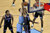 Sacramento Kings forward Louis King (23) and Memphis Grizzlies center Killian Tillie (35) reach for the ball in the first half of an NBA basketball game Friday, May 14, 2021, in Memphis, Tenn. (AP Photo/Brandon Dill)