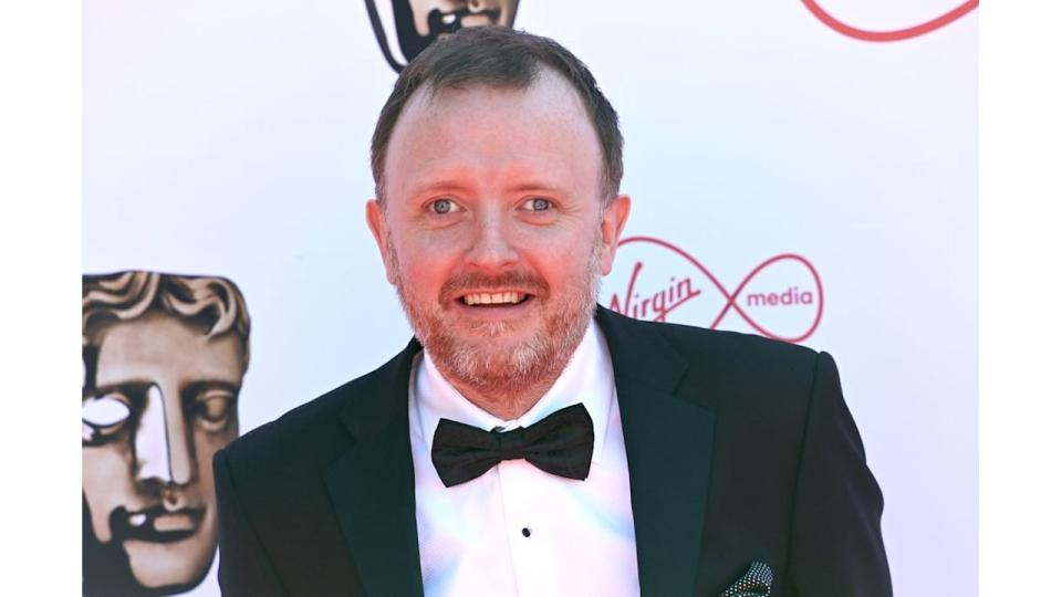 Chris McCausland smiling in black tie