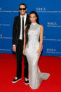 <p>make their <a href="https://people.com/politics/kim-kardashian-pete-davidson-attend-white-house-correspondents-dinner/" rel="nofollow noopener" target="_blank" data-ylk="slk:red carpet couple debut in style;elm:context_link;itc:0;sec:content-canvas" class="link ">red carpet couple debut in style</a> wearing a black suit with matching sunglasses, a skinny tie, and Vans (on Davidson), and a glittering, second-skin Balenciaga gown (on Kardashian). </p>