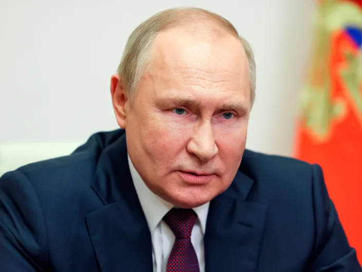 Russian President Vladimir Putin delivers an address via video conference.