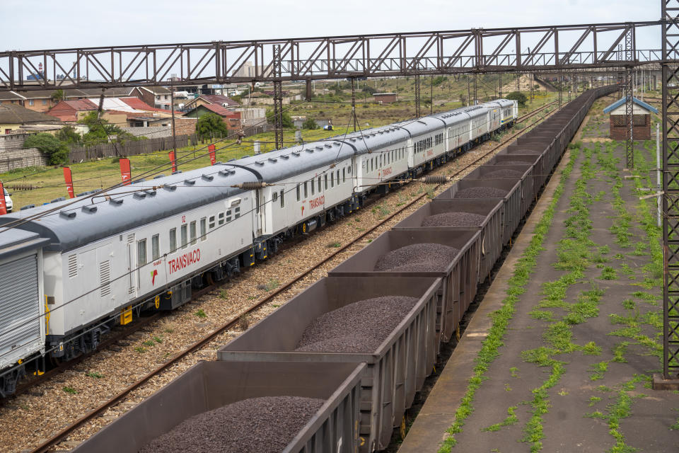 A COVID-19 vaccination train is parked at the Swartkops railroad yard outside Gqeberha, South Africa, Thursday Sept. 23, 2021. South Africa has sent a train carrying COVID-19 vaccines into one of its poorest provinces to get doses to areas where healthcare facilities are stretched. The vaccine train, named Transvaco, will go on a three-month tour through the Eastern Cape province and stop at seven stations for two weeks at a time to vaccinate people. (AP Photo/Jerome Delay)