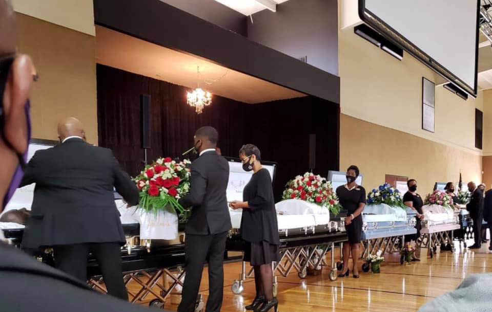 Five caskets lined up at the funeral for Sheletta Brundidge's relatives. (Courtesy Sheletta Brundidge)