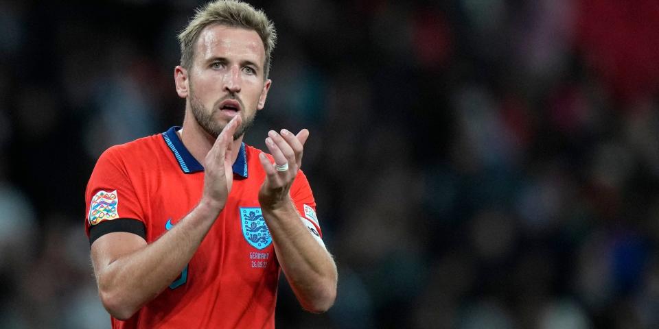 Harry Kane claps during an England soccer match.