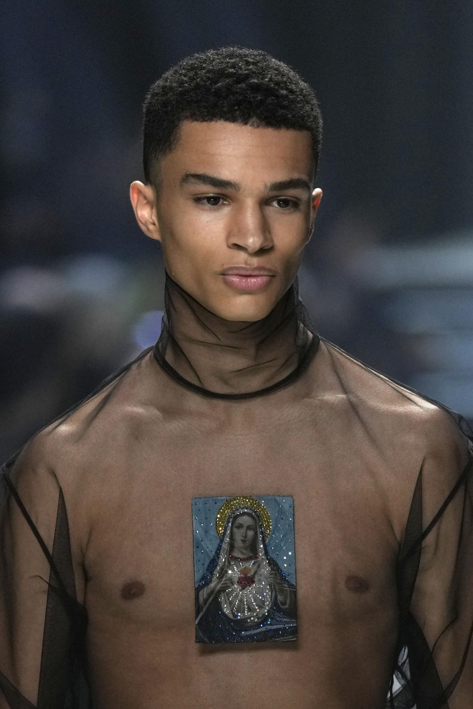 A model wears a creation as part of the Dolce & Gabbana, menswear Fall-Winter 2023-24 collection presented in Milan, Italy, Saturday, Jan. 14, 2023. (AP Photo/Antonio Calanni)