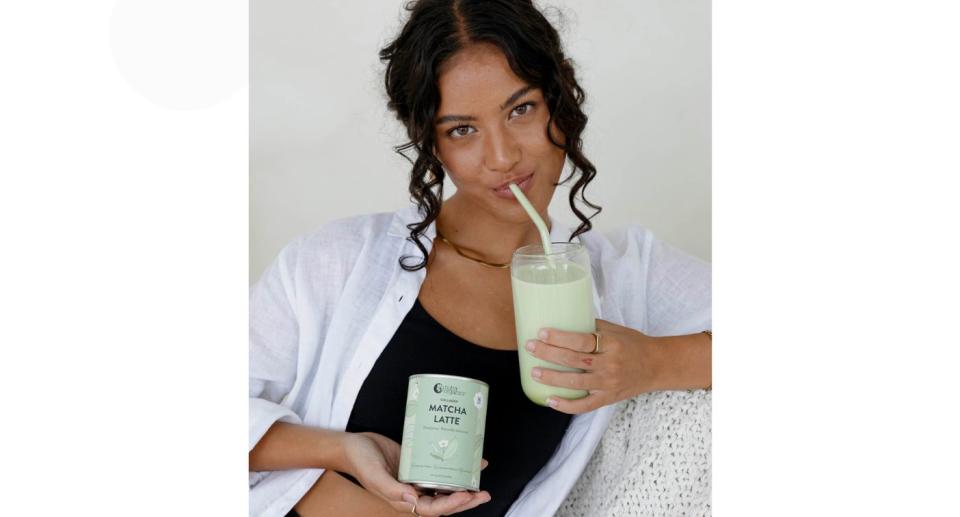 Woman drinking Collagen Matcha Latte