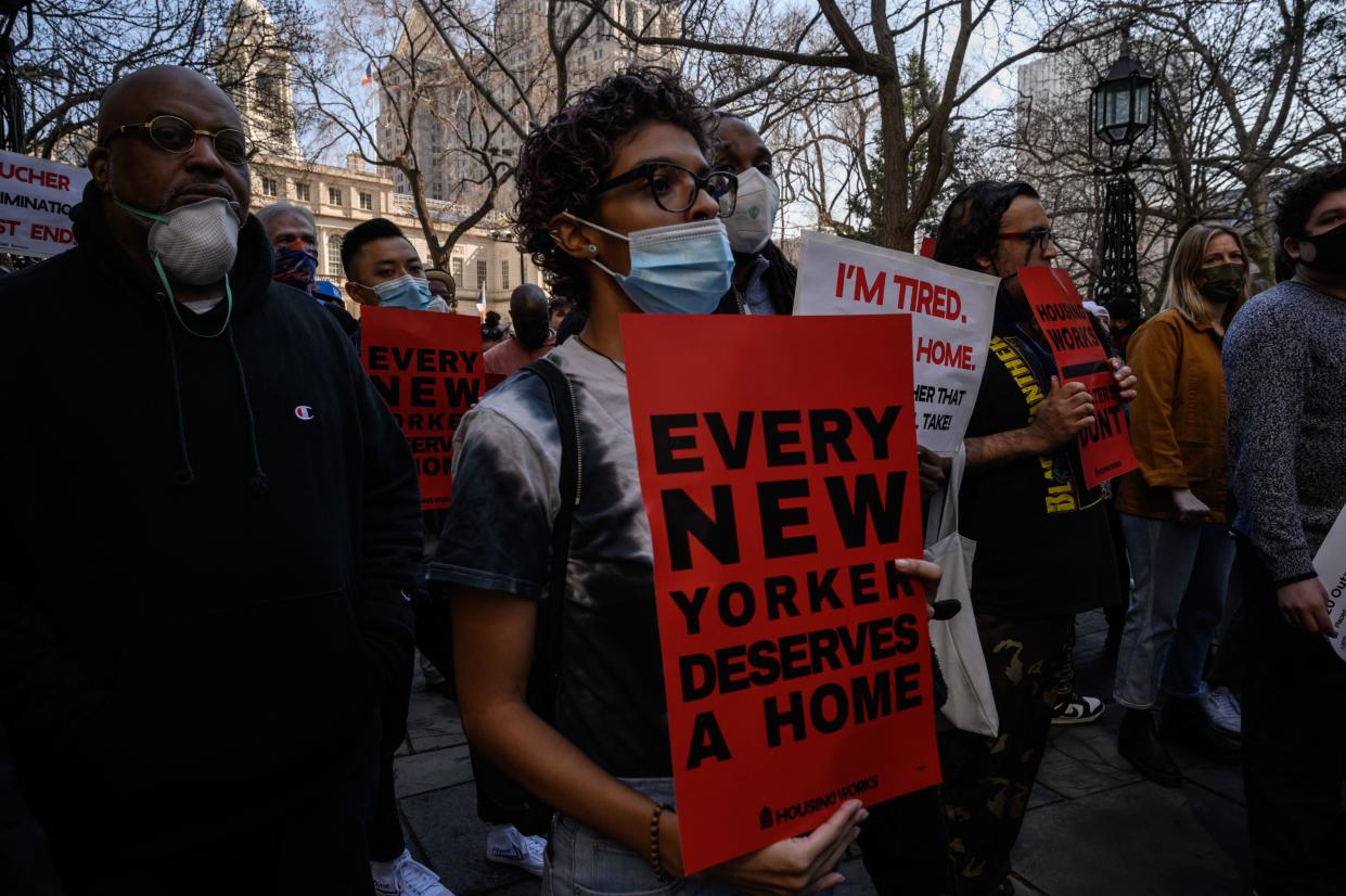 At City Hall in New York City, activists and homeless people call for greater access to housing and better conditions at shelters