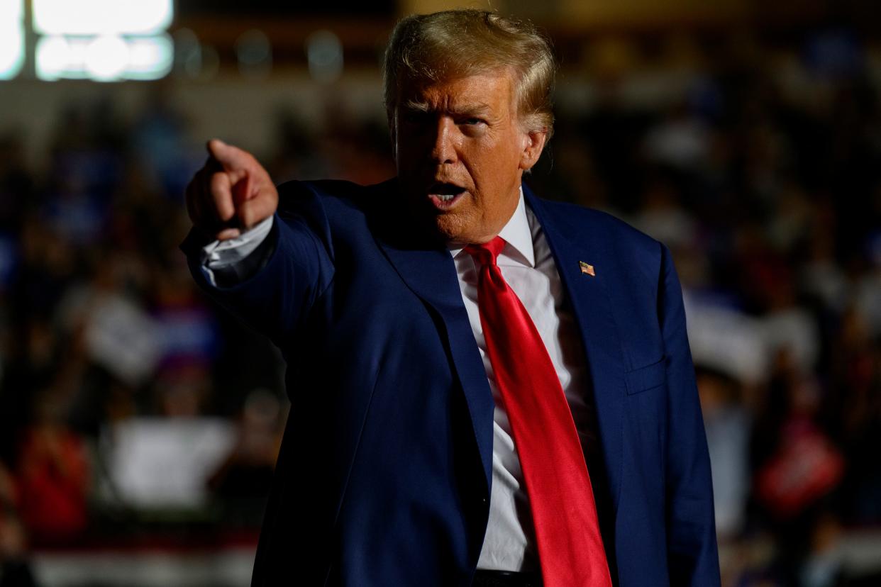 Former U.S. President Donald Trump gestures as he enters the Erie Insurance Arena for a political rally while campaigning for the GOP nomination in the 2024 election on July 29, 2023 in Erie, Pennsylvania.