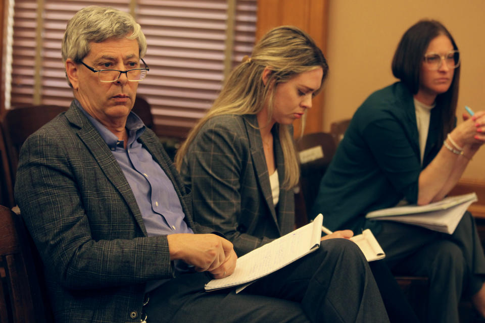 Clay Barker, general counsel for the Kansas secretary of state's office, monitors negotiations between the Kansas House and Senate over elections legislation, Monday, April 1, 2024, at the Statehouse in Topeka, Kan. Secretary of State Scott Schwab has remained neutral on a plan from fellow Republicans to end the extra three days voters have after Election Day to return mail ballots. (AP Photo/John Hanna)