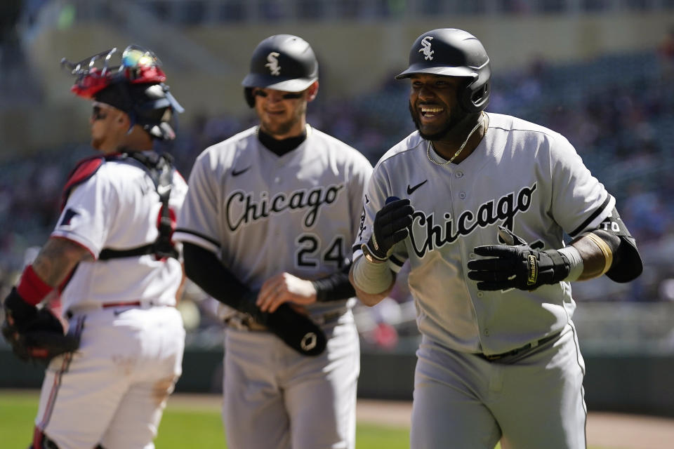 Chicago White Sox's Hanser Alberto, right, celebrates after hitting a three-run home run against the Minnesota Twins during the fourth inning of a baseball game, Monday, April 10, 2023, in Minneapolis. (AP Photo/Abbie Parr)