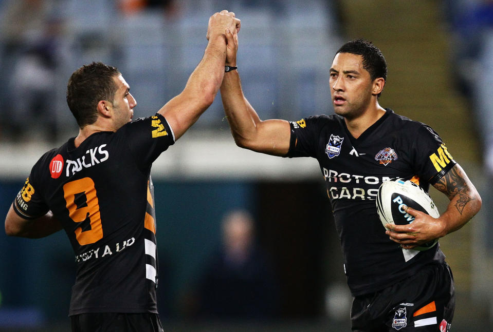 SYDNEY, AUSTRALIA - JUNE 04:  Benji Marshall (R) of the Tigers celebrates with Robbie Farah after scoring a try during the round 13 NRL match between Canterbury Bulldogs and the Wests Tigers at ANZ Stadium on June 4, 2010 in Sydney, Australia.  (Photo by Matt King/Getty Images)