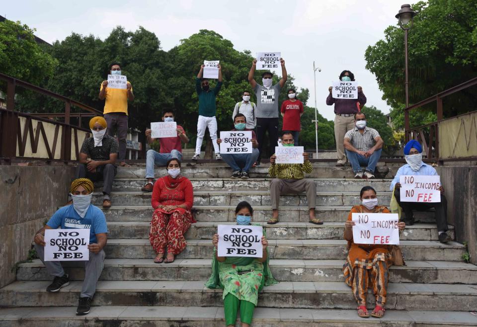 CHANDIGARH, INDIA - JUNE 7: Parents of students enrolled in private schools protesting against demands for fee during the lockdown, at Sector 17 Plaza, on June 7, 2020 in Chandigarh, India. (Photo by Keshav Singh/Hindustan Times via Getty Images)