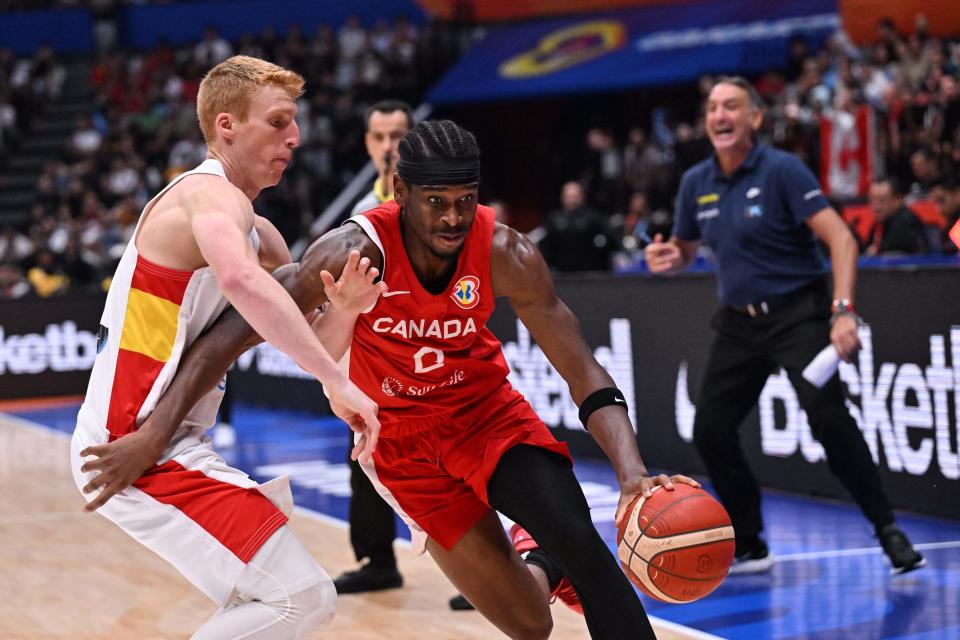 Canada’s Shai Gilgeous-Alexander (R) dribbles as Brazil’s Alberto Diaz (L) tries to block during the FIBA Basketball World Cup match between Spain and Canada at Indonesia Arena in Jakarta on September 3, 2023. (Photo by ADEK BERRY / AFP) (Photo by ADEK BERRY/AFP via Getty Images)