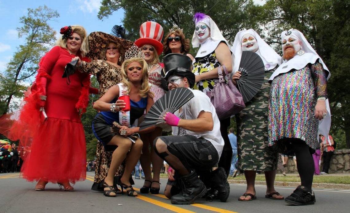 Drag queens, many from charitable and/or HIV/AIDS education organizations, pose for group shots before the start of the parade at the annual N.C. Gay Pride march and rally.