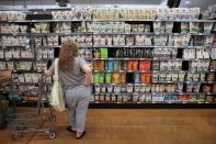 FILE PHOTO: A person shops in a supermarket as inflation affected consumer prices in Manhattan, New York City