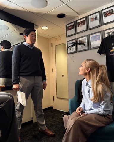 <p>Elizabeth Gillies/Instagram</p> Bowen Yang and Ariana Grande talk backstage before a skit on 'Saturday Night Live'