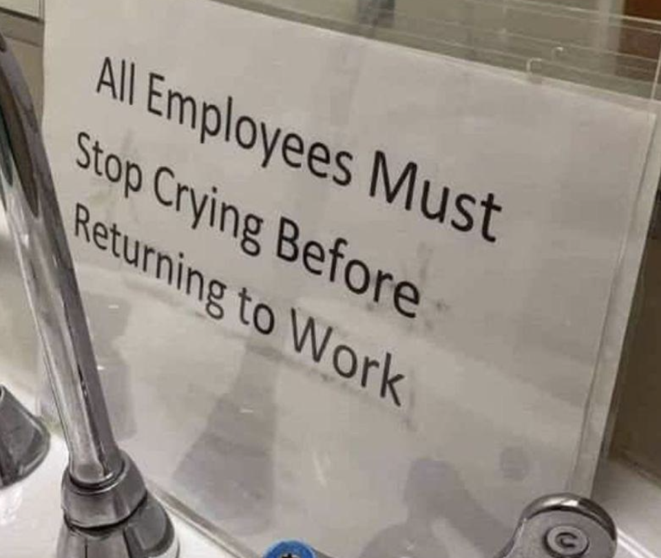 Sign reads "All Employees Must Stop Crying Before Returning to Work" displayed near a sink