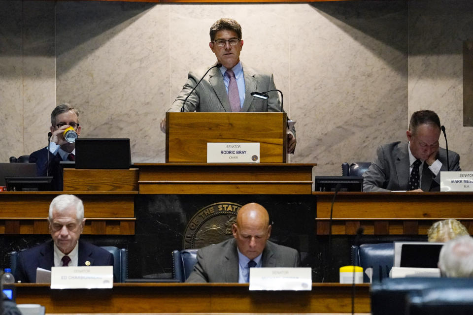 Senate President Pro Tem Rodric Bray, R-Martinsville, top, opens the second day of hearings in the Indiana Senate Rules Committee as they take testimony on a Republican proposal to ban nearly all abortions in the state at the Statehouse in Indianapolis, Tuesday, July 26, 2022. (AP Photo/Michael Conroy)