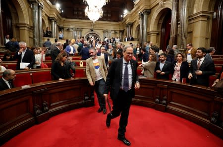 Catalan leader Quim Torra leaves the chamber in Barcelona